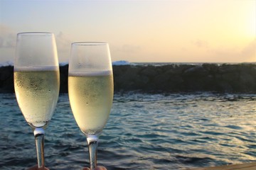 Champagne glasses and Beautiful Sunset at Maldives