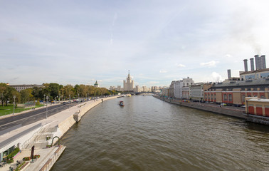 View of Moskva river and Kotelnicheskaya Embankment Building from new floating bridge in Zaryadye park, Moscow, Russia. The park was inaugurated on 9 September 2017