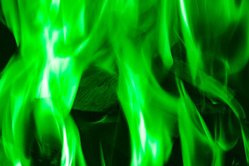 green flame on black background, background for placing text