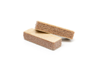 Fresh crispy waffles with dark filling on a white background
