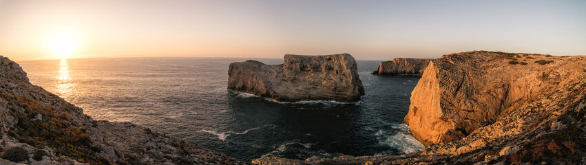 Rugged cliffs of the coastline of Cape St. Vincent at sunset.  Near Lagos, Algarve region of Portugal.