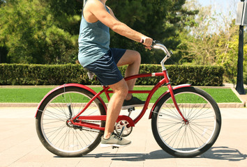 Fototapeta premium Man riding bike outdoors on sunny day