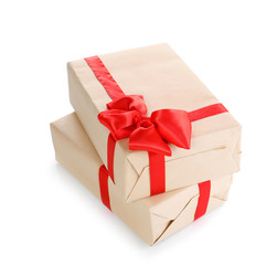 Parcels wrapped in kraft paper with red bow on white background