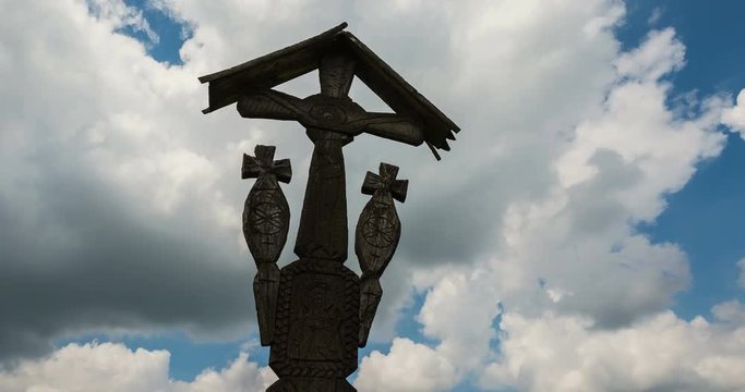 Low angle view of wooden cross against sky.
Time lapse shot.