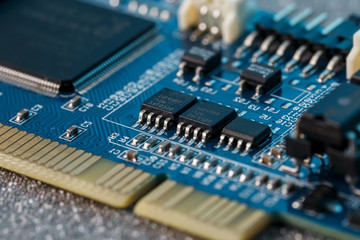 Electronic circuit board close up. Processor, chips and capacitors.