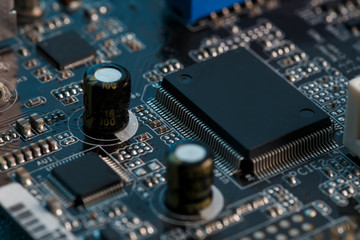 Electronic circuit board close up. Processor, chips and capacitors.