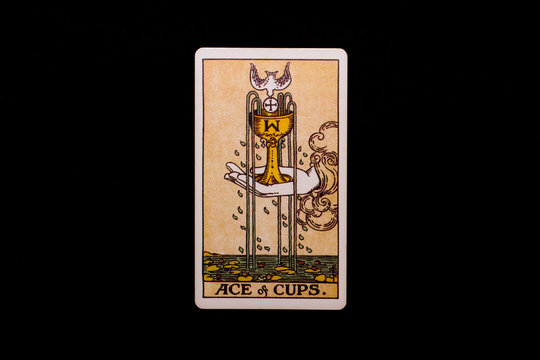 An individual minor arcana tarot card isolated on black background. Ace of cups.