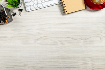 Business workspace Mock up : Desk with laptop,notebook and a cup of coffee. Top view with copy space.