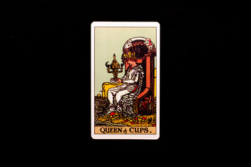An individual minor arcana tarot card isolated on black background. Queen of cups.