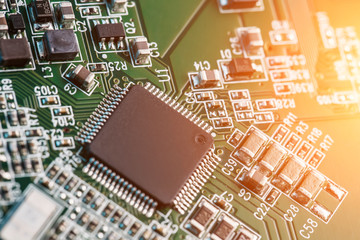 Electronic circuit board close up. Processor, chips and capacitors.