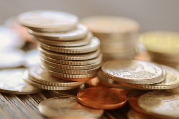 Row of coins on wood background for finance and Saving concept,Investment, Economy, Soft focus and dark style.