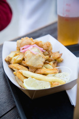 Fish and ships with a pint of beer served at the street cafe