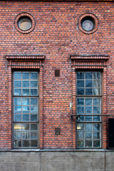 Four windows on a brick wall