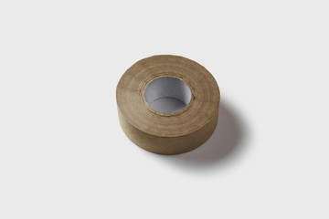 Adhesive tape roll isolated on soft gray background.