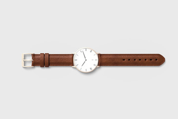 Brown leather watch for men isolated on soft gray background. - obrazy, fototapety, plakaty