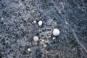 Blue cracked surface of the ice surface
