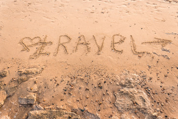Summer drawn letters on a sandy beach. Text template pattern. Creative typography for holiday greetings.