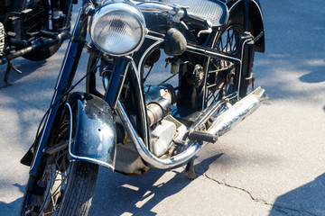 Close-up of motorcycle parked on city street