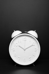 Time concept Alarm clock on black background Copy space for text Retro style