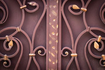 wrought-iron gates, ornamental forging, forged elements close-up