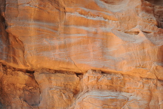 archaeological and graffiti on stones in a canyon of the wadi rum desert in jordan