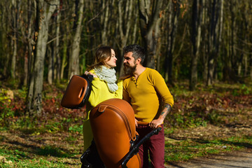 They love weekends. Couple in love walk in autumn park outdoor. Happy family members with baby...