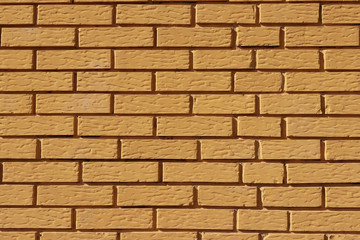 Yellow painted brick wall
