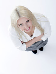 Top view. Successful business woman is looking at the camera.