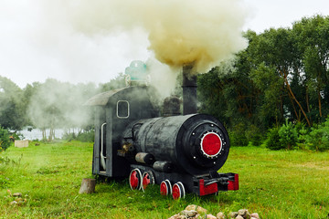 Fototapeta na wymiar the smoke in the sky from the steam locomotive