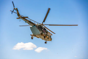 military helicopter flying during exercise performing a military demonstration