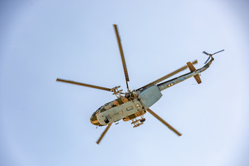 Fototapeta na wymiar military helicopter flying during exercise performing a military demonstration