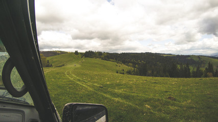 Traveling by car in the mountains. Ukrainian expedition "Carpathian border". April 2018. Offroad car. The beauty of the tops. Ukrainian Carpathian Mountains
