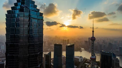 Fototapete Sunset of Shanghai Skyline and Silhouette Of Modern Megalopolis. © Askar