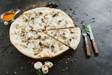 Vegetarian mushroom pizza on black background