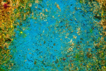 Bright background. Artifacts on the asphalt after the Spring Festival of colors. Holiday and joy concept.