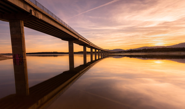 Bridge And Water During Sunset