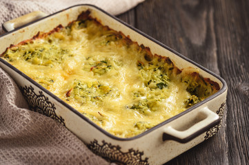 Zucchini and potatoe casserole with cheese,  vegetarian food.