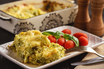 Zucchini and potatoe casserole with cheese,  vegetarian food.