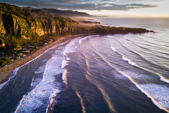 Aerial view of beautiful sunset at Punakaiki beach in New Zealand