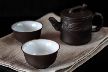 Chinese brown teapot and cups for tea