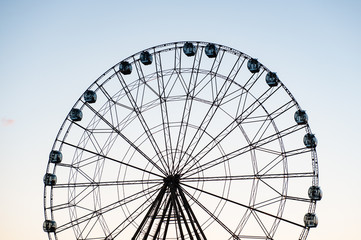 Ferris wheel on blue sky background