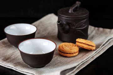 Chinese brown teapot and cups for tea