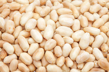 Close up heap of peanuts baked isolated in the studio.