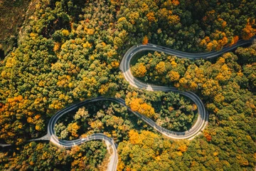  Extreme winding road in sunset light. Aerial view. © Calin Stan