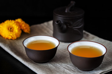 Chinese brown teapot and cups for tea