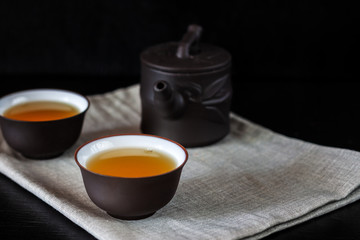 Chinese brown teapot and cups for tea