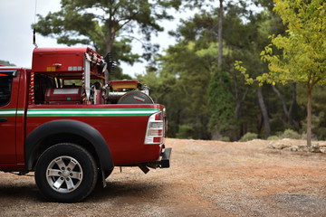 SUV pickup fire engine in forest