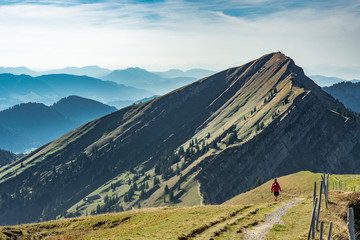 nice senior woman, hiking in fall, autumn  on the ridge of the Nagelfluh chain near Oberstaufen,...