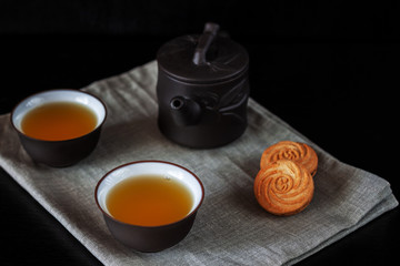 Chinese brown teapot and cups for tea