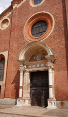 Fototapeta na wymiar Fragment of the facade of the Church of St. Mary Grace -Chiesa di Santa Maria delle Grazie-. The church was built in 1497. A popular tourist attraction